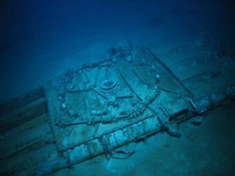 Quadruple torpedo tube mount on seabed - roller bearings visible